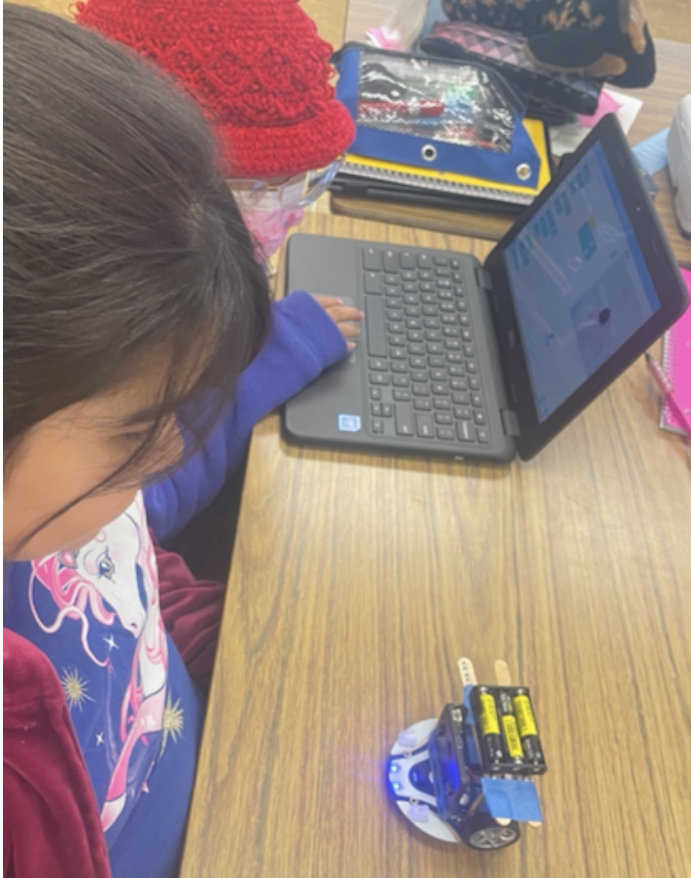 Students using Microbits